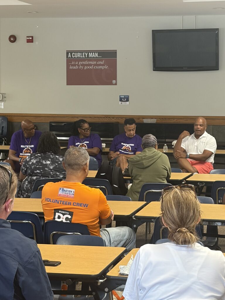 Drew Hawkins of Edyoucore addresses parents at the baskketball camp