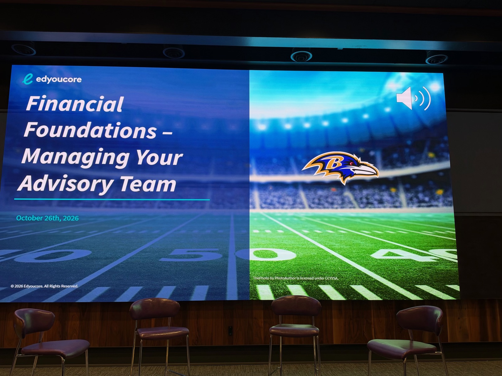 Stage and presentation screen for Edyoucore’s Financial Foundations: Managing Your Advisory Team session with the Baltimore Ravens.