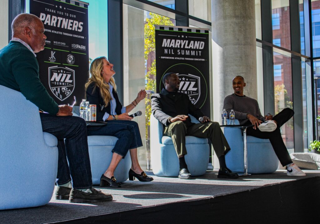 Four panelists in discussion onstage at the Maryland NIL Summit.